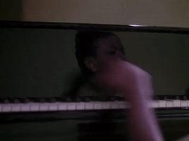 classic film piano GIF