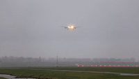 Airplanes at Amsterdam Airport Make Impressive Landings on Rainy Runway