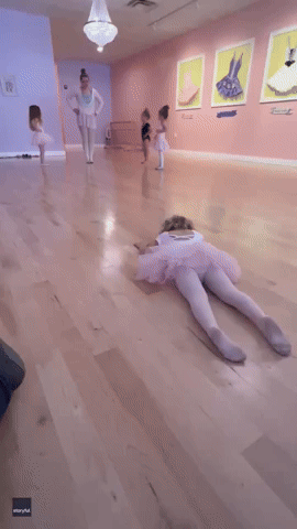 Three-Year-Old Ballerina Slithers Across Floor During Class