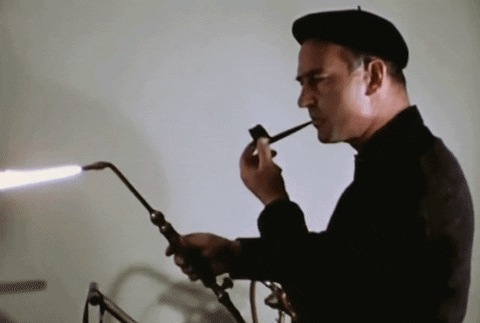 Artmediaholdings giphyupload blowtorch midcenturymodern enjoyingasmoke GIF