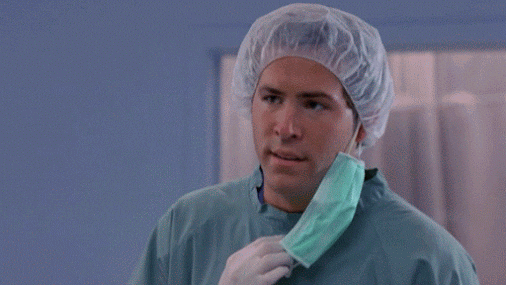 Movie gif. Ryan Reynolds as Spence in Scrubs wearing surgical scrubs with his mask dangling off of one ear looks puzzled and implores, "but why?"