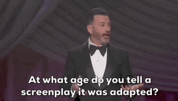 Oscars 2024 gif. Host Jimmy Kimmel addresses the entire audience with open palms and asks, "At what age do you tell a screenplay it was adapted?"
