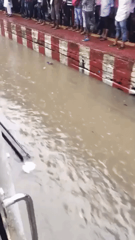 Mumbai Rain Submerges Train Tracks at Busy Railway Station
