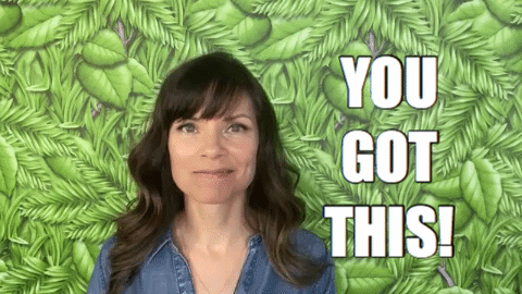 Video gif. A happy looking woman points at us and says, "You got this."