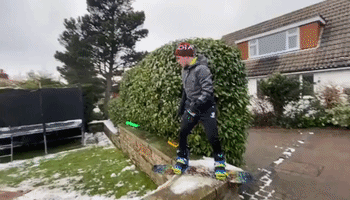 Determined North Yorkshire Snowboarder Performs Tricks on Smattering of Backyard Snow