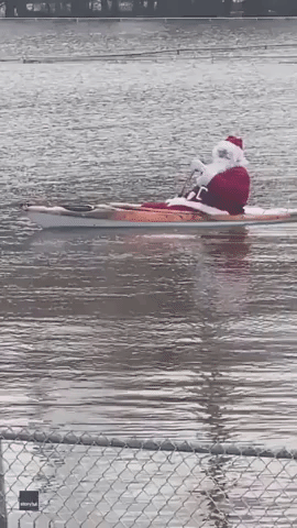 Santa Spotted Kayaking Through Flooded Baseball Field in Maine