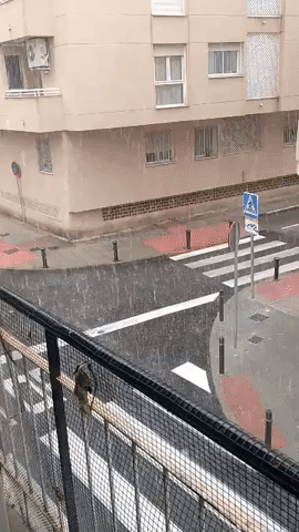 Streams of Hail and Rain Run Through Streets of Alicante, Spain