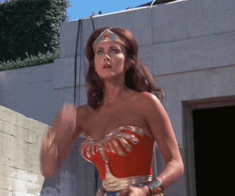 Wonder Woman deflecting bullets with her magic bracelets