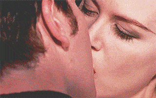 Movie gif. Nicole Kidman as Satine in Moulin Rouge passionately kisses Ewan McGregor as Christian.