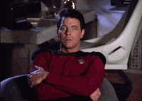 TV gif. Jonathan Frakes as Riker in Star Trek sits in a chair with his arms crossed and he's visibly annoyed as he sighs and prepares to get up.