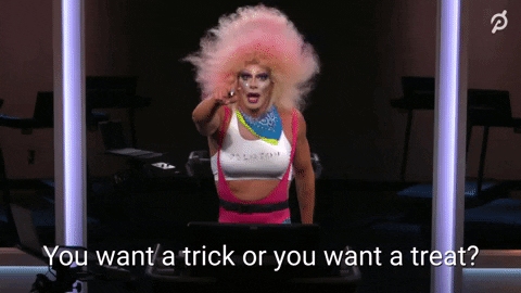 Ad gif. An instructor from Peloton is dressed up for Halloween and they ask us, "Do you want a trick or do you want a treat?"