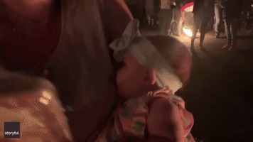 Light Sleeper: Baby Snoozes Happily as Parents Enjoy Idaho Lantern Festival