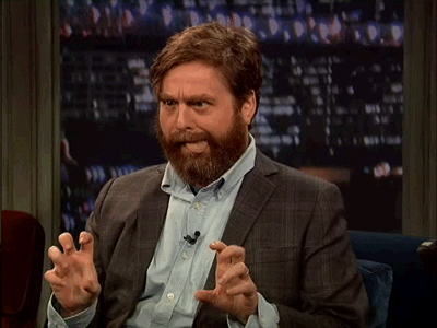 Celebrity gif. Zach Galifianakis waggles his tongue wildly and stares cross-eyed while miming with his fingers like he's grabbing breasts.
