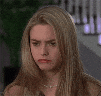 Movie gif. Alicia Silverstone as Cher in Clueless rolls her eyes and glances to the side in disgust. 