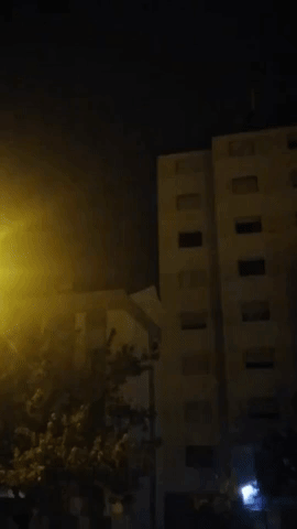 Lightning Illuminates the Night Sky During Thunderstorm Near Lisbon