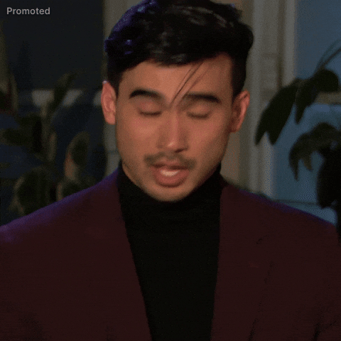 Sponsored gif. Thomas Nguyen, a contestant from season 21 of The Bachelorette, twists his face in anguish and frustration as he raises his hands to his face, running them through his hair and looking down with a grimace. 