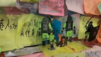 Paper Police Dolls Illustrating Protest Violence Adorn Hong Kong's 'Lennon Wall'