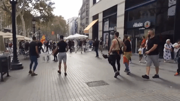Protesters Clash in Barcelona as Spain Celebrates its National Day