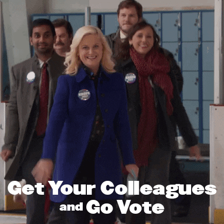 Parks and Recreation gif. Amy Poehler as Leslie wearing a campaign button excitedly leads a group of smiling colleagues into a polling place. Text, “Get your colleagues and go vote.”
