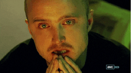 TV gif. Aaron Paul as Jesse in Breaking Bad. His eyes are brimmed with red, as if he hasn't slept for a while, and he puts his hands in prayer hands at his lips, contemplating.