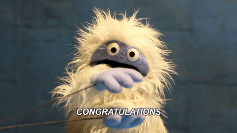 Video gif. A yeti puppet claps his hands. Text, “Congratulations.”
