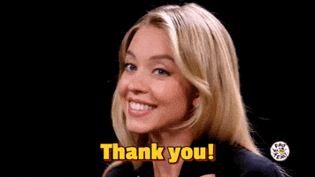 Celebrity gif. Sydney Sweeney on Hot Ones smiles and basks, saying "Thank you!"