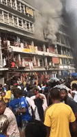 Goods Thrown From Burning Building at Busy Lagos Market