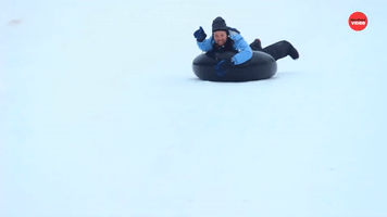 Australian Man Goes Snow Tubing