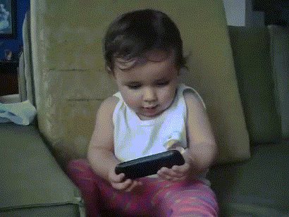 Video gif. Adorable baby puts a phone to her ear and begins to chat and gesture dramatically, mimicking her mother.