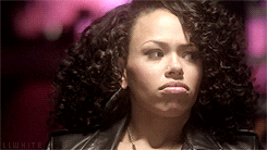 Celebrity gif. Elle Varner rolls her eyes and slowly sinks out of sight as if embarrassed. 