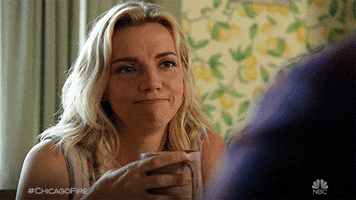 TV gif. Kara Killmer as Sylvie in Chicago fire nods in agreement as she holds a coffee cup. 