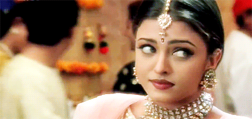 Celebrity gif. Aishwarya Rai Bachchan rolls her eyes dramatically and looks away with an annoyed expression on her face.