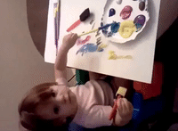 Curious Toddler Teaches Herself to Fingerpaint