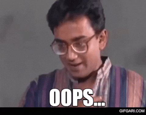 Celebrity gif. Young Humayun Ahmed, a Bangledeshi novelist, is shocked but laughing as he clasps both hands over him mouth in glee. Text, "Oops."