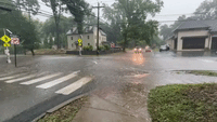 Cars Plow Through Flooded Intersection as Rain Swamps Swarthmore, Pennsylvania