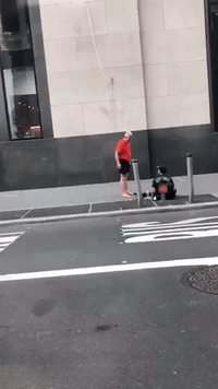 Runner Walks Off Barefoot After Gifting Shoes to Man Sitting on New York Sidewalk
