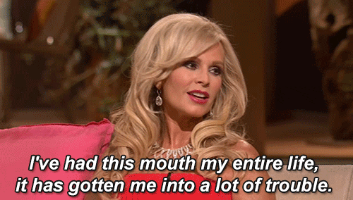 Reality TV gif. Tamra Judge on Real Housewives of Orange County sitting on a couch turns her head and says, "I've had this mouth my entire life, it's gotten me into a lot of trouble."