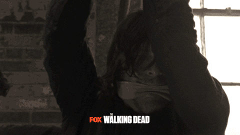 struggling the walking dead GIF