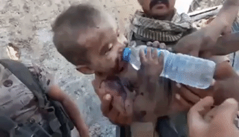 Child Takes Water After Being Rescued From Under Rubble in Old Mosul