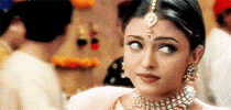 Celebrity gif. Aishwarya Rai Bachchan rolls her eyes dramatically and looks away with an annoyed expression on her face.