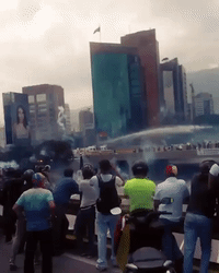 Police Fire Water Cannons, Tear Gas at Caracas Protesters