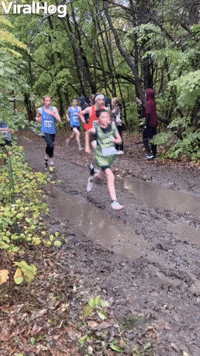 Athlete Dives Into Mud Puddle During Race