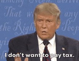 Political gif. Donald Trump stands behind a microphone and shrugs his shoulders. Text, "I don't want to pay tax." 