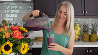 lady pouring smoothie