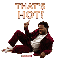 Sponsored sticker gif. Man lies on his side in a suggestive pose. He winks and points upward at floating text that reads, “That’s hot!”