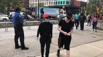Officers Hand Out Masks Ahead of George Floyd Memorial in Brooklyn