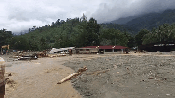Locals Survey Damage After Deadly Flooding in Indonesia