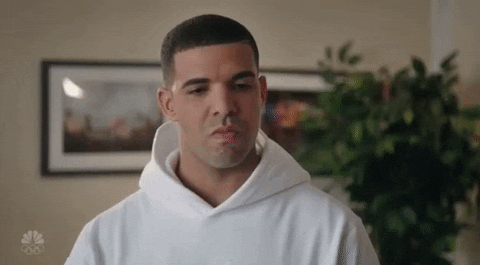 SNL gif. Angry Drake clenches his teeth and shakes his head, looking annoyed.
