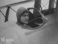 NationalWWIMuseum black and white smiling airplane pilot GIF