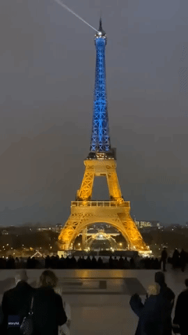 Eiffel Tower Lights Up in Blue and Yellow Ahead of First Anniversary of Ukraine War